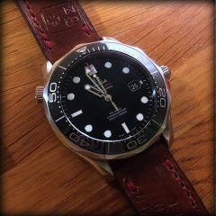 omega seamaster sur ammo canotage fil rouge